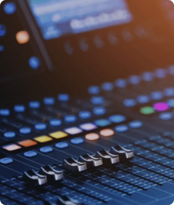 A close-up of a professional mixing console