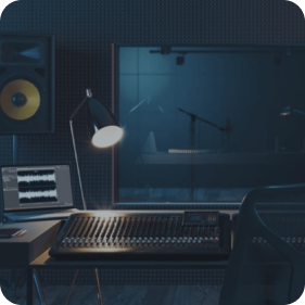 A professional recording studio with acoustic panels, a studio monitor speaker, a mixing console, and a soundproof recording booth visible through a window.